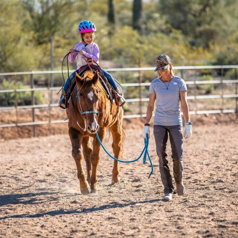 woman in ride proud horse riding bootleg pants