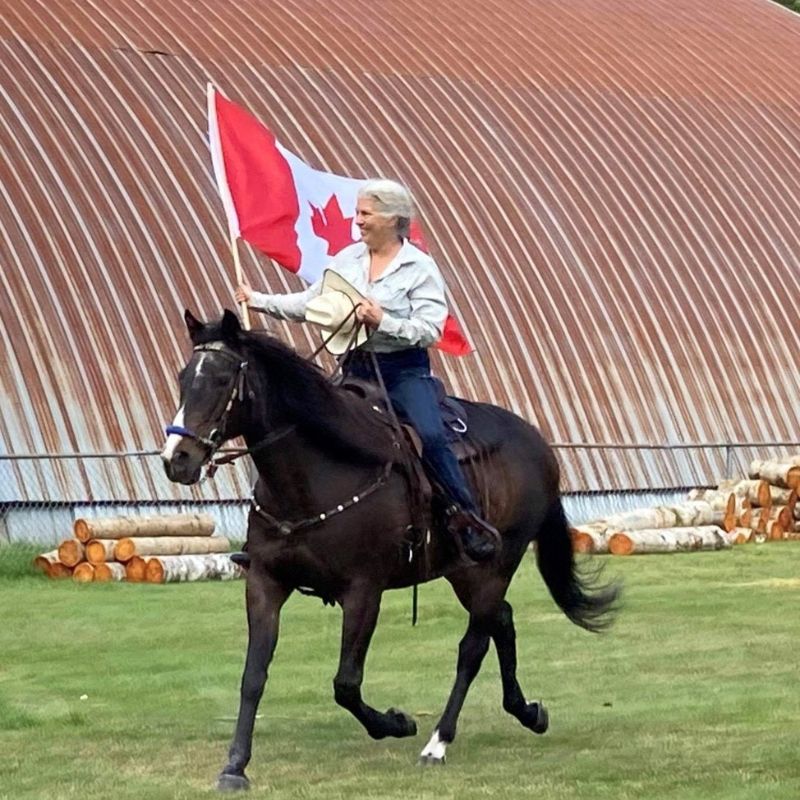 woman in horizon pants bearing canadian flag