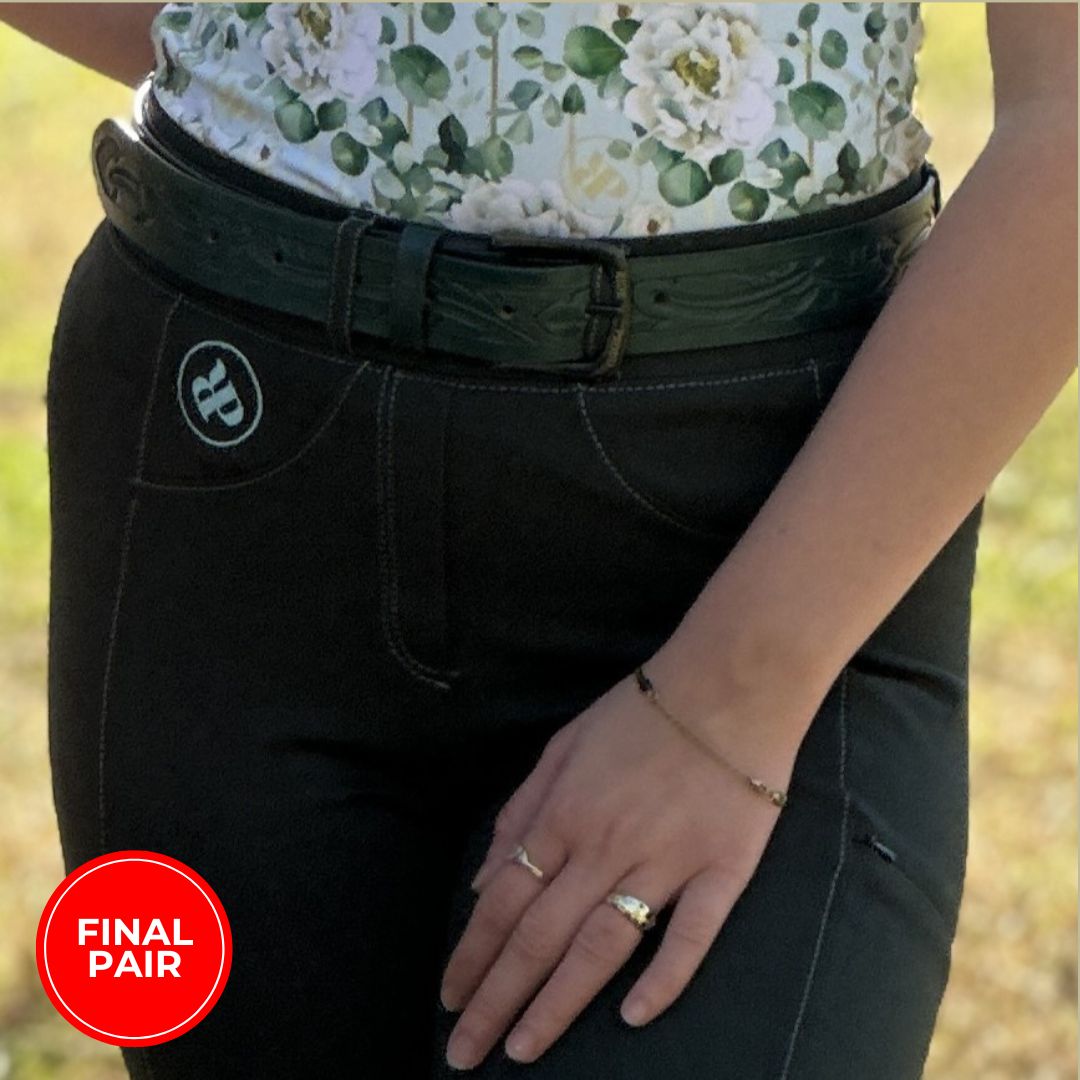 woman in bootcut compass horse riding tights in forest green