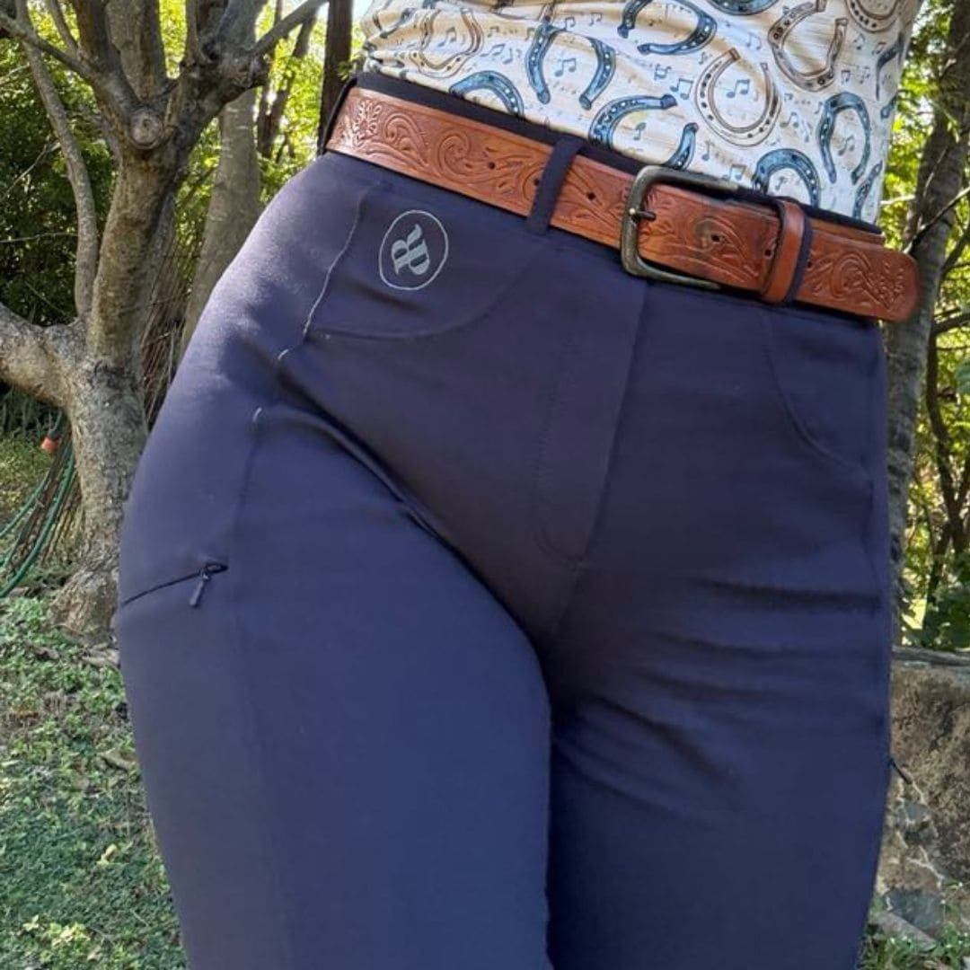 woman in horse riding bootcut tights in navy
