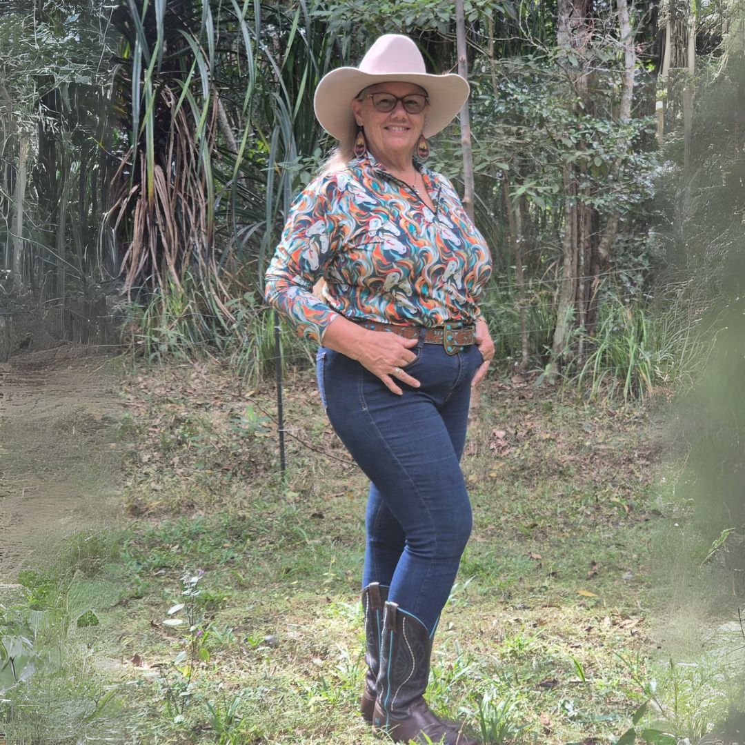 women in horse riding shirt aurora from ride proud