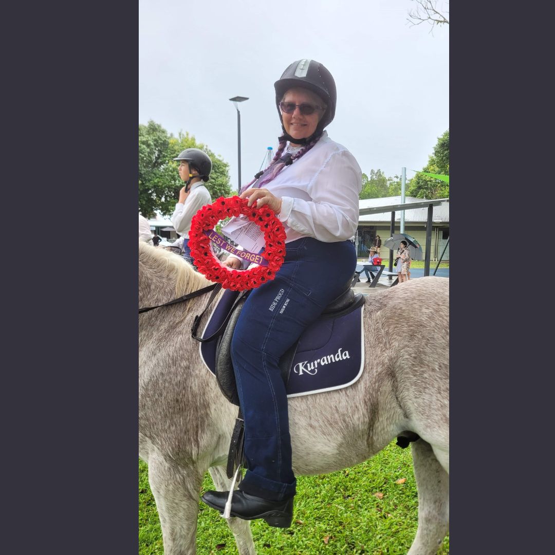 woman in ride proud show ring jeans riding in a white horse