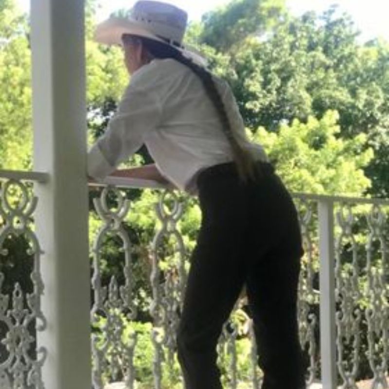 back view of a woman wearing pants