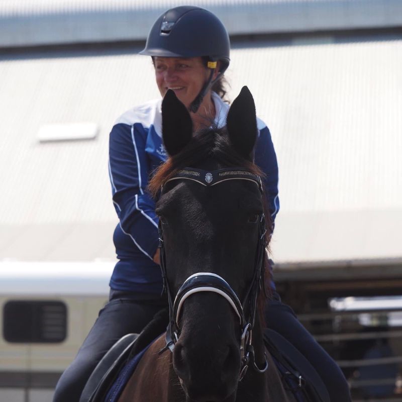 woman in horse riding pants equitation ride proud