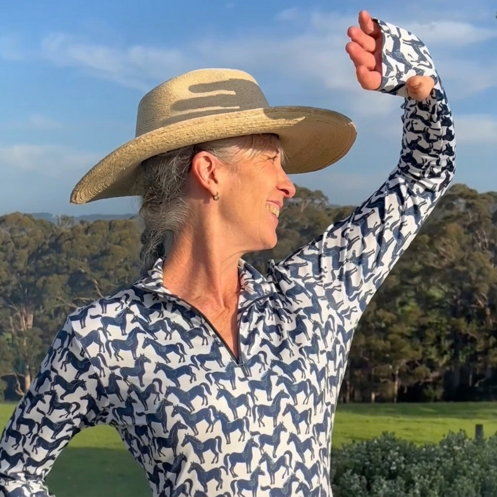 Woman wearing The Mob, horse riding shirt, styled for a day with horses
