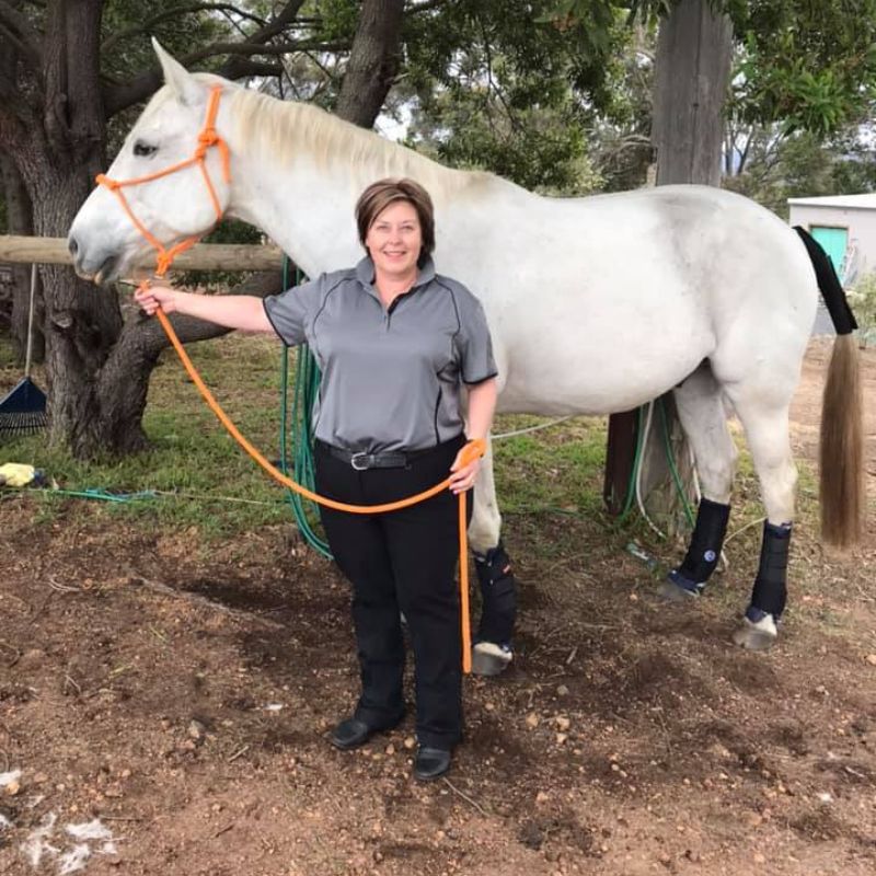 woman with a white horse