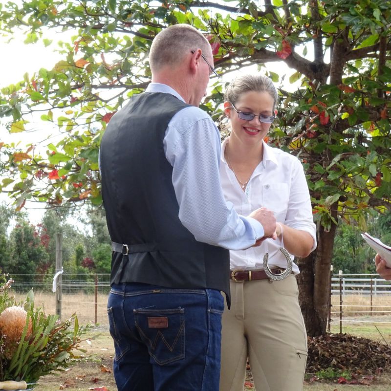 woman smiling standing beside a man