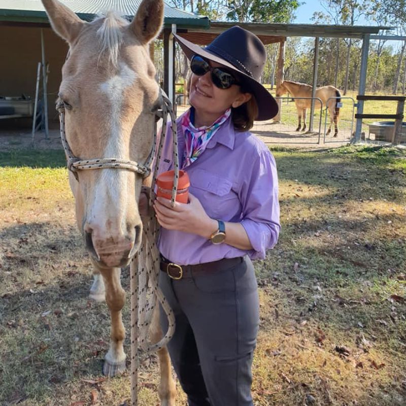woman holding a tumbler 
