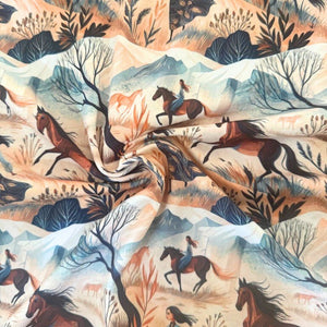 Fabric with a scenic pattern of horses, riders, and nature.