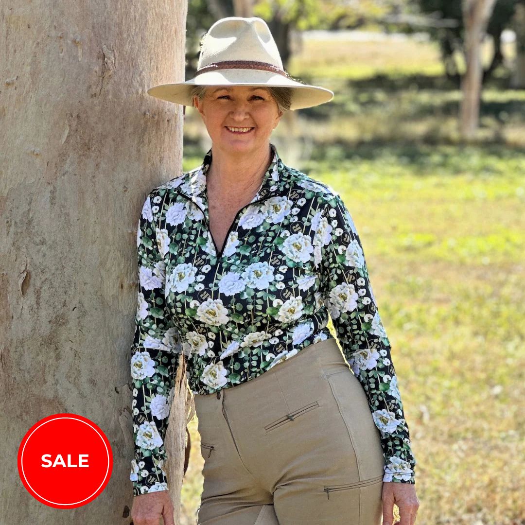 woman in horse riding shirt in peony print dark long sleeve from ride proud clothing