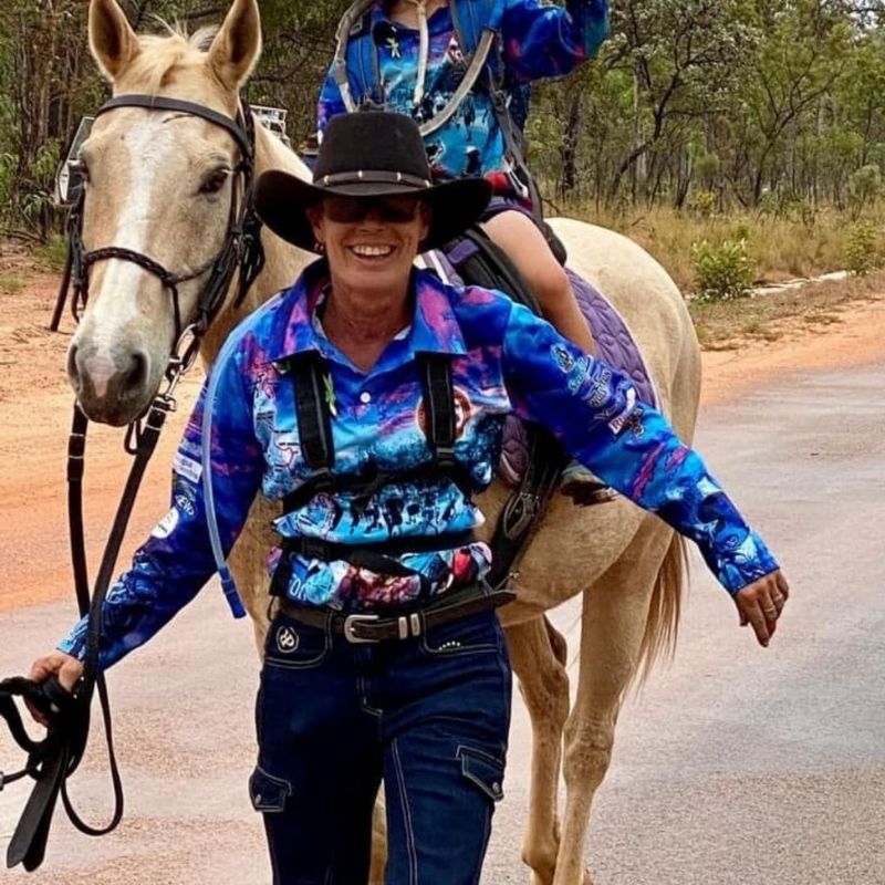 woamn in her horizon jeans smiling