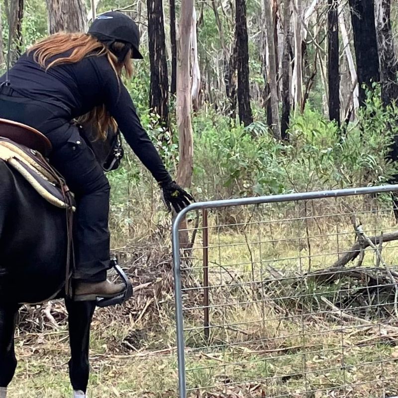 woman in black trainer pants and jacket