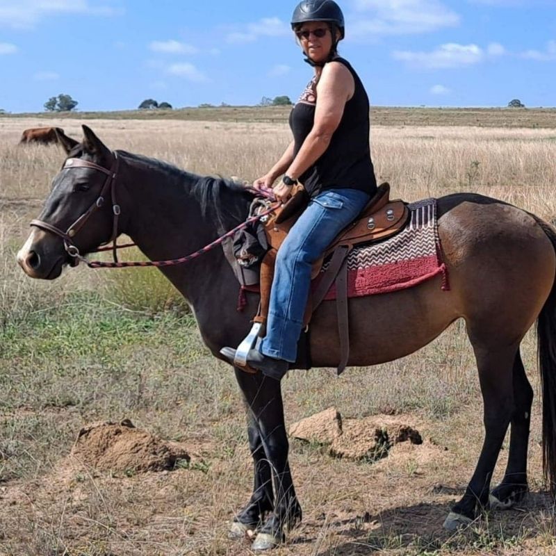 woman in her horizon jeans and black sleeveless top