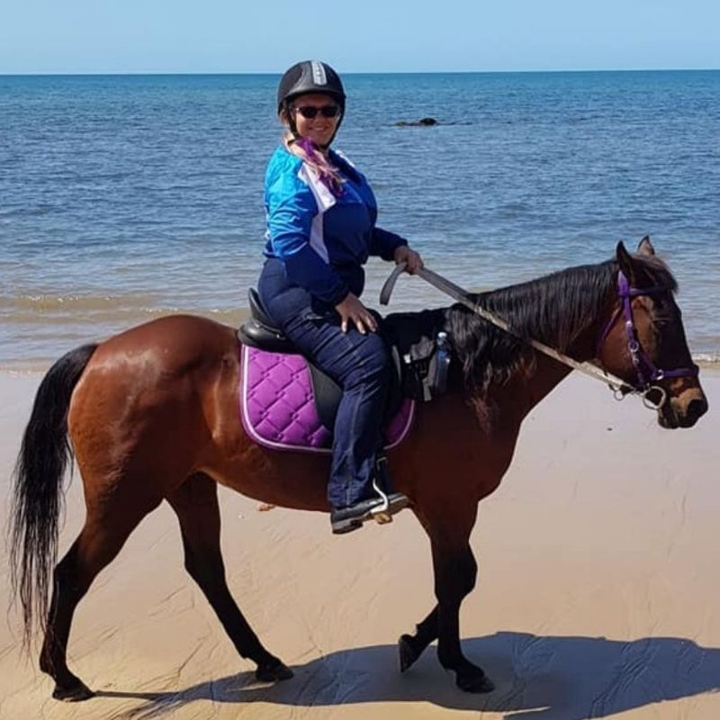 woman in her horizon jeans near the beach