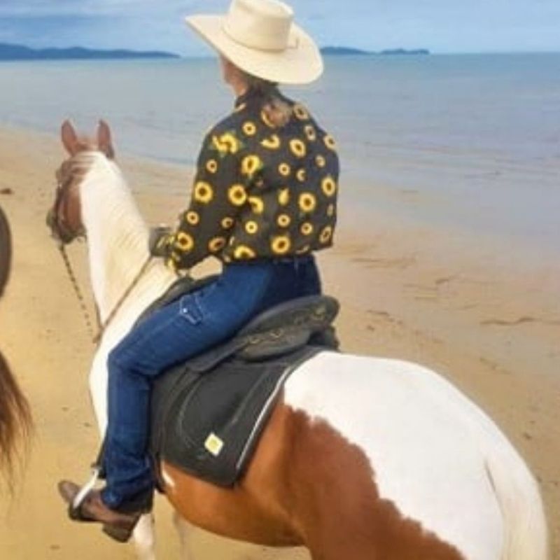 woman in horizon jeans near the beach