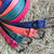Leather belts in the colours of red, green, tan and blue