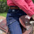Woman in Saddle Wearing Horse Riding Jeans from Ride Proud Clothing