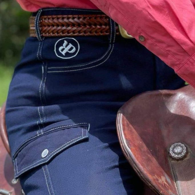 Woman in Saddle Wearing Horse Riding Jeans from Ride Proud Clothing